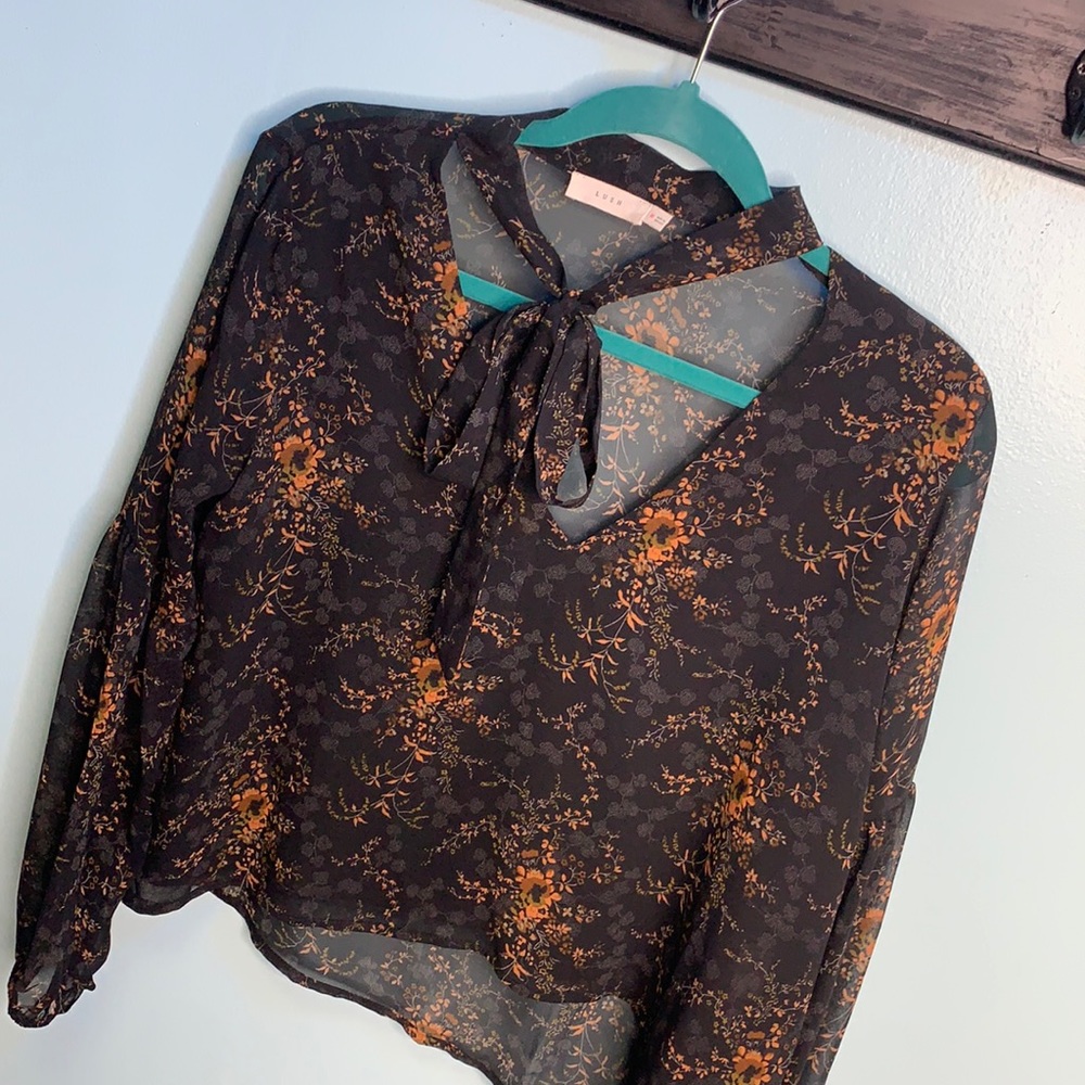 Women’s black and orange floral blouse. Tie neck